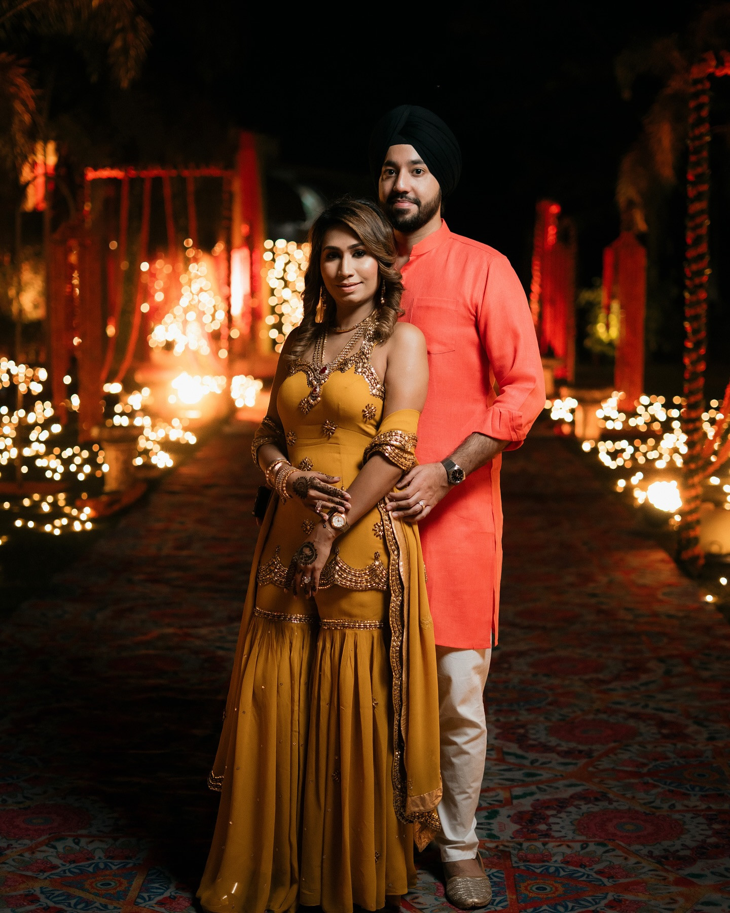 A couple sharing a moment during mehndi