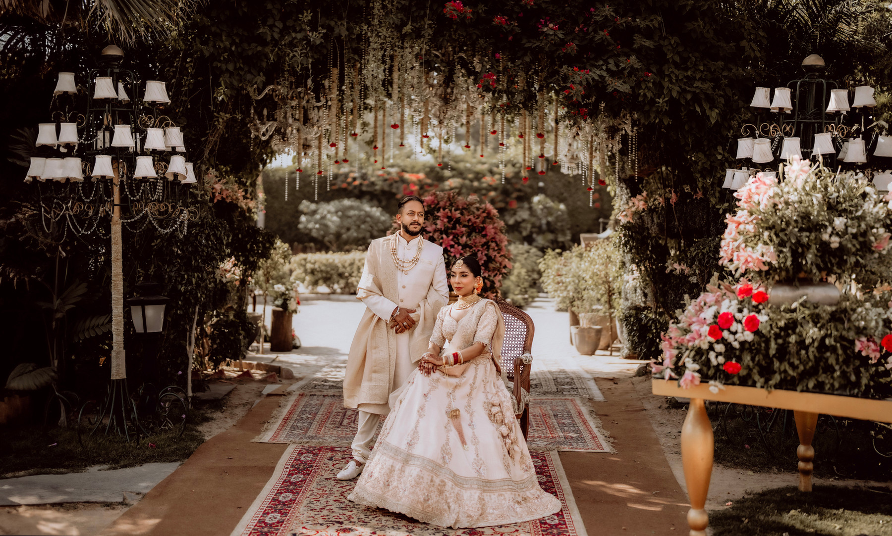 A couple together in a garden at their wedding